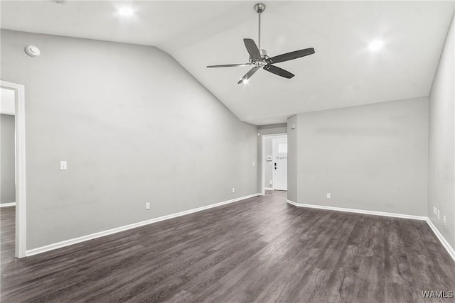 empty room with dark wood-style floors, lofted ceiling, baseboards, and a ceiling fan