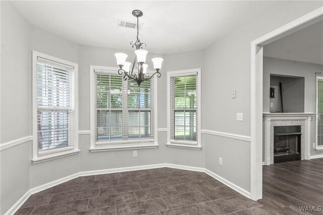 unfurnished room featuring dark hardwood / wood-style flooring, a raised ceiling, and ceiling fan