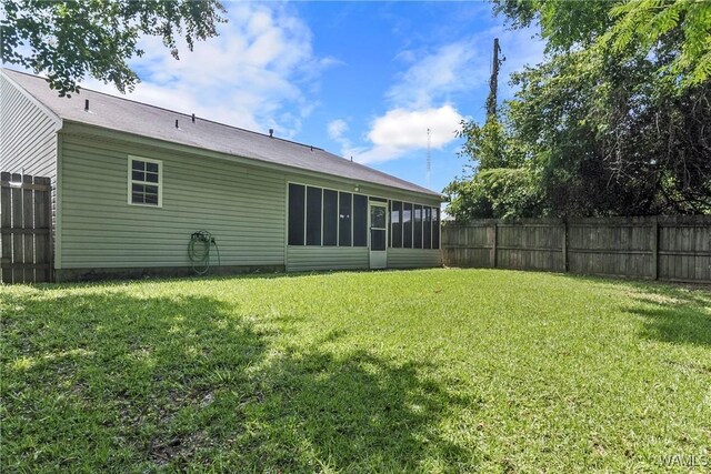 ranch-style home with a front lawn and a garage