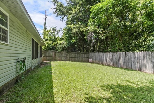 view of yard with a sunroom