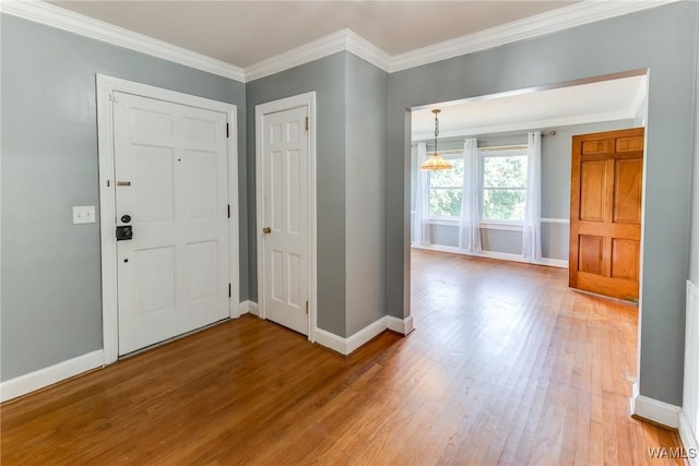 9C Country Club Hls, Tuscaloosa, AL 35401 - foyer with wood finished floors, baseboards, and ornamental molding