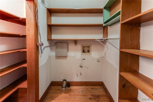 9C Country Club Hls, Tuscaloosa, AL 35401 - laundry room featuring hookup for a washing machine, hardwood / wood-style flooring, and baseboards