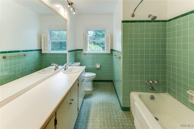 9C Country Club Hls, Tuscaloosa, AL 35401 - full bathroom with tile walls, vanity, tile patterned floors, toilet, and a wainscoted wall