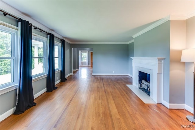 9C Country Club Hls, Tuscaloosa, AL 35401 - unfurnished living room featuring wood finished floors, baseboards, a fireplace with flush hearth, and ornamental molding