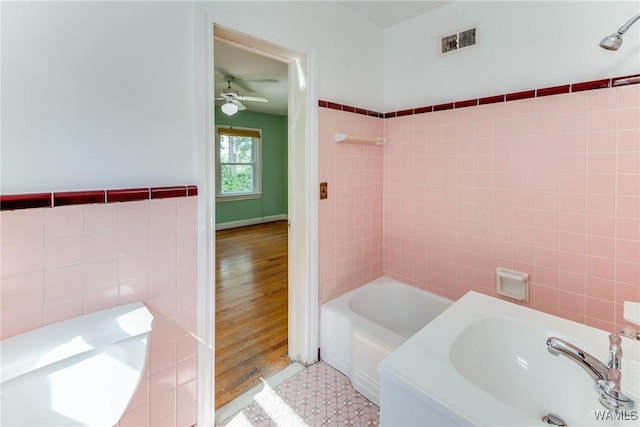 9C Country Club Hls, Tuscaloosa, AL 35401 - bathroom with tile walls, a ceiling fan, and tub / shower combination