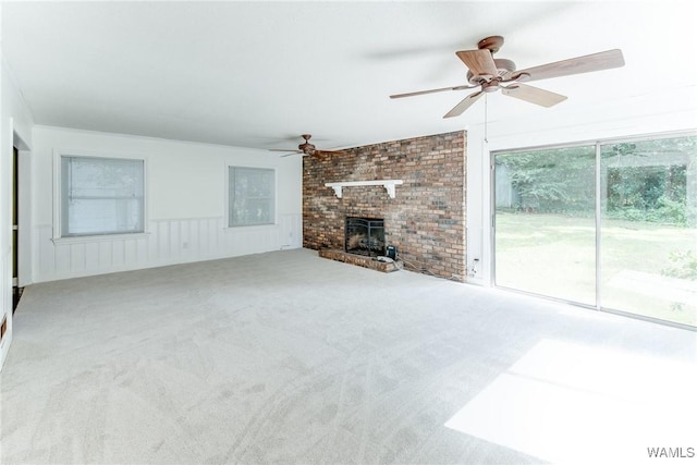 9C Country Club Hls, Tuscaloosa, AL 35401 - unfurnished living room featuring a ceiling fan, carpet floors, wainscoting, and a fireplace