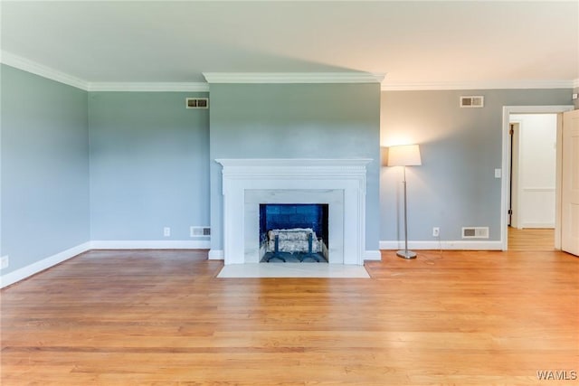 9C Country Club Hls, Tuscaloosa, AL 35401 - unfurnished living room with light wood-style floors, crown molding, baseboards, and a fireplace with flush hearth