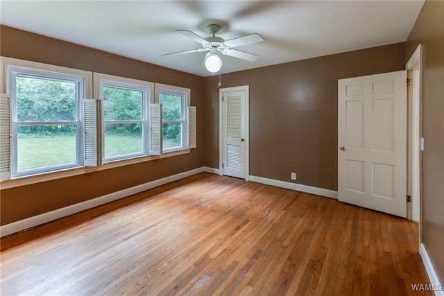 9C Country Club Hls, Tuscaloosa, AL 35401 - unfurnished bedroom with baseboards, light wood-type flooring, a closet, and ceiling fan
