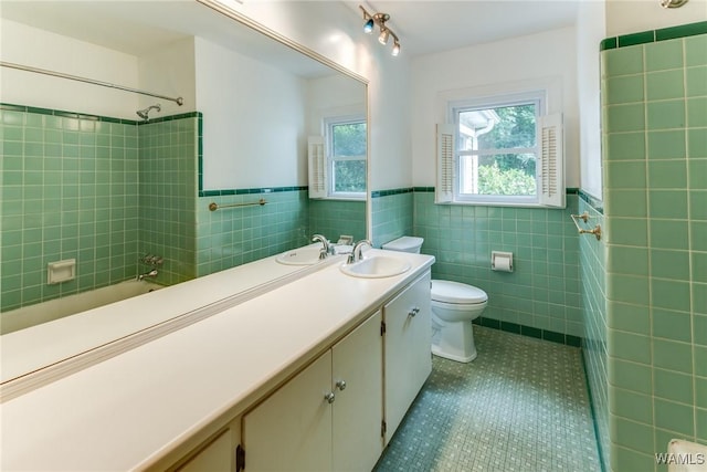 9C Country Club Hls, Tuscaloosa, AL 35401 - bathroom with tile walls, tile patterned floors, tub / shower combination, toilet, and vanity