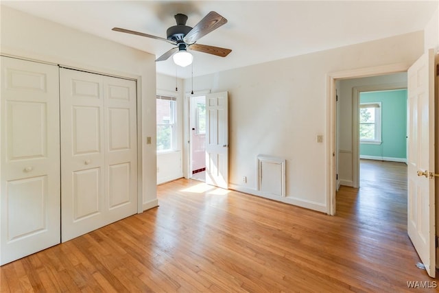 9C Country Club Hls, Tuscaloosa, AL 35401 - unfurnished bedroom featuring light wood finished floors, a closet, baseboards, and ceiling fan