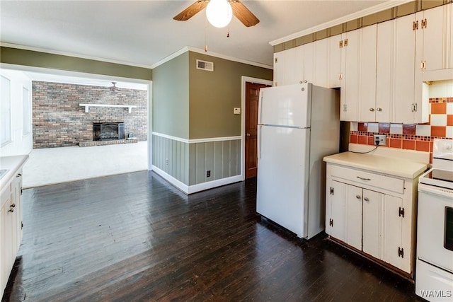 9C Country Club Hls, Tuscaloosa, AL 35401 - kitchen featuring white appliances, a ceiling fan, dark wood-type flooring, a fireplace, and light countertops