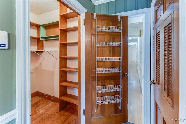 9C Country Club Hls, Tuscaloosa, AL 35401 - spacious closet featuring wood finished floors