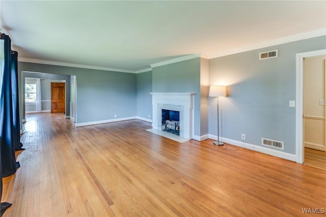 9C Country Club Hls, Tuscaloosa, AL 35401 - unfurnished living room with light wood-style flooring, baseboards, crown molding, and a fireplace with flush hearth