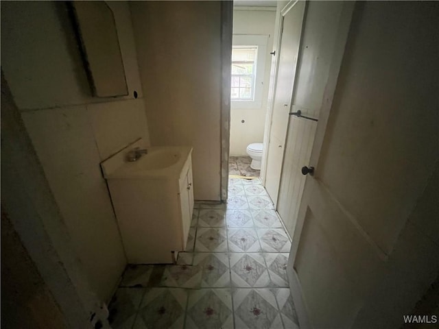 bathroom with tile patterned floors, toilet, and vanity