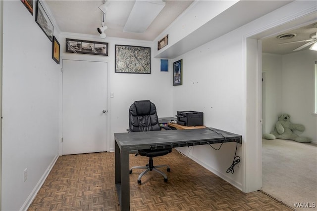 home office with dark parquet floors and ceiling fan