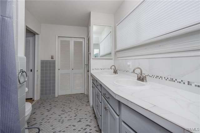 bathroom featuring vanity, toilet, and tile patterned floors