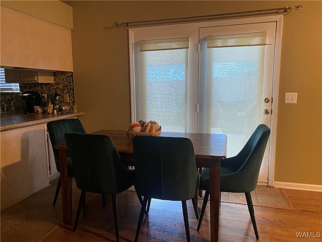 dining room with light hardwood / wood-style flooring