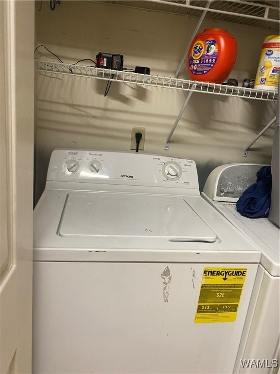 clothes washing area with independent washer and dryer