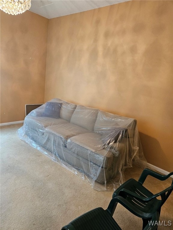 bedroom featuring carpet flooring and a notable chandelier