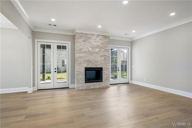 5930 Carleton Park Cir, Tuscaloosa, AL 35406 - unfurnished living room featuring visible vents, french doors, light wood-style floors, and crown molding