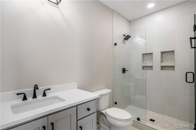 5930 Carleton Park Cir, Tuscaloosa, AL 35406 - bathroom featuring toilet, vanity, and a stall shower