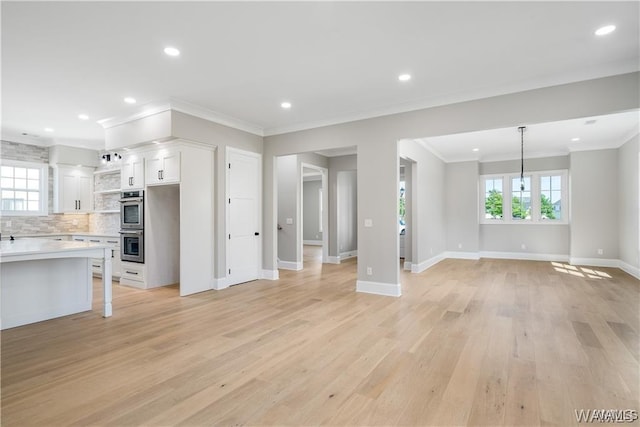 5930 Carleton Park Cir, Tuscaloosa, AL 35406 - unfurnished living room featuring a wealth of natural light, recessed lighting, light wood-type flooring, and ornamental molding