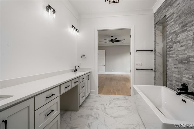 5930 Carleton Park Cir, Tuscaloosa, AL 35406 - full bathroom with a freestanding tub, crown molding, a sink, marble finish floor, and double vanity