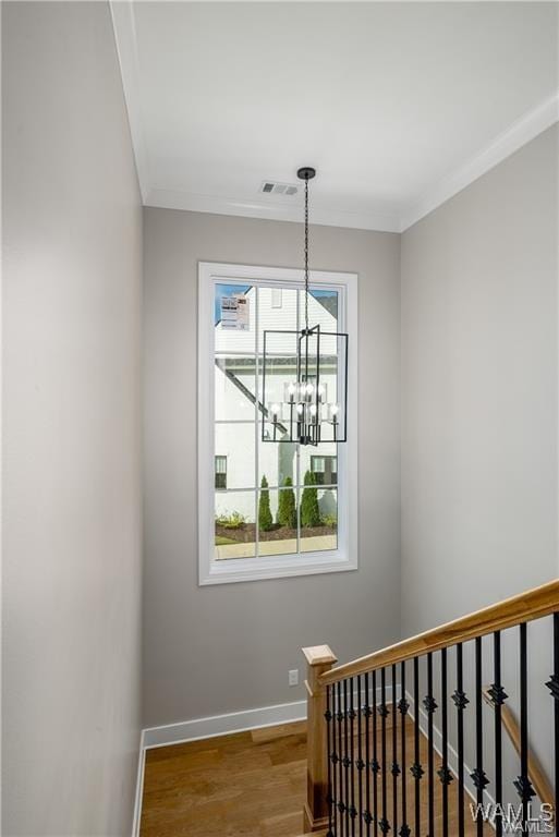 5930 Carleton Park Cir, Tuscaloosa, AL 35406 - stairway featuring visible vents, a chandelier, crown molding, baseboards, and wood finished floors