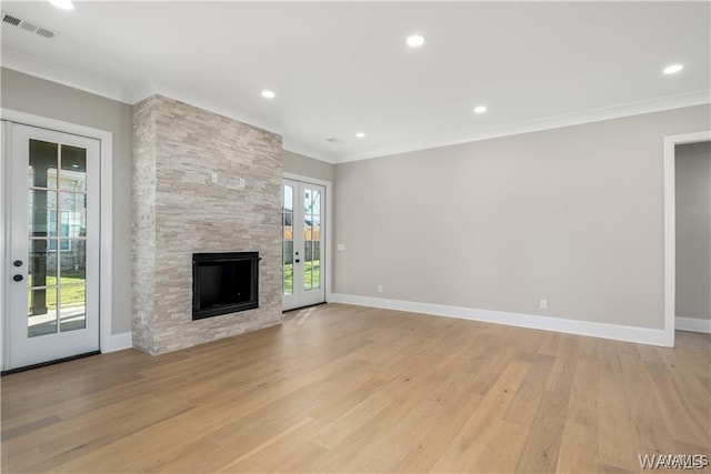 5930 Carleton Park Cir, Tuscaloosa, AL 35406 - unfurnished living room with visible vents, light wood-style flooring, ornamental molding, and a healthy amount of sunlight
