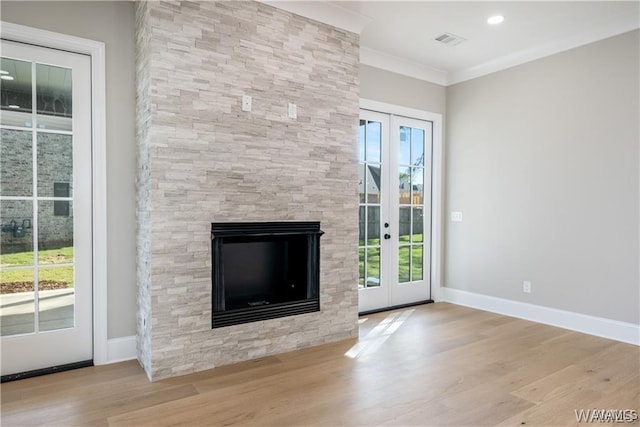 5930 Carleton Park Cir, Tuscaloosa, AL 35406 - unfurnished living room featuring french doors, a fireplace, wood finished floors, visible vents, and ornamental molding