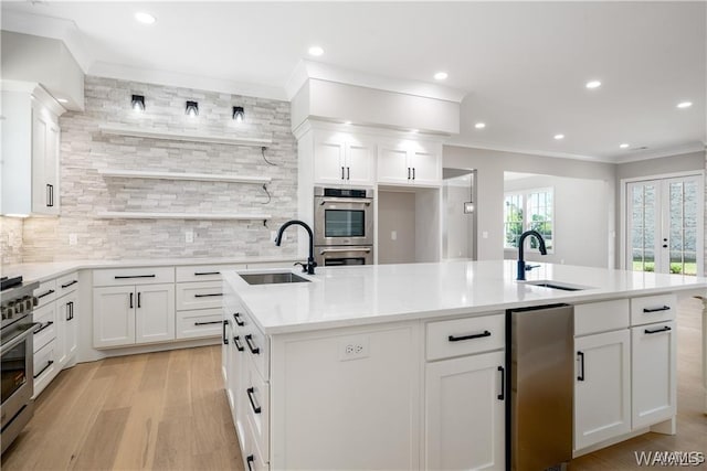 5930 Carleton Park Cir, Tuscaloosa, AL 35406 - kitchen featuring a sink, a kitchen island with sink, and appliances with stainless steel finishes