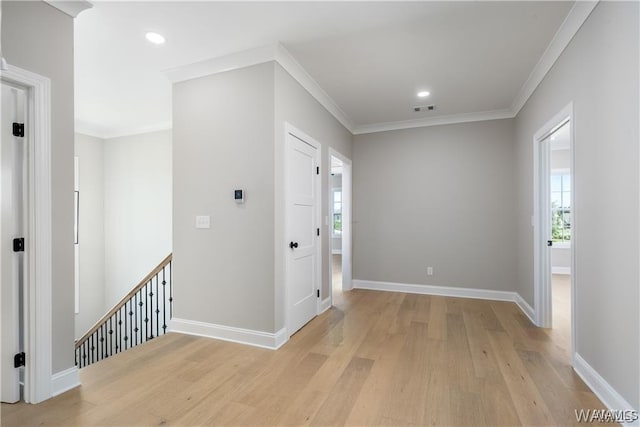 5930 Carleton Park Cir, Tuscaloosa, AL 35406 - entryway with light wood-type flooring, crown molding, a healthy amount of sunlight, and visible vents