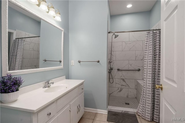 6650 Flatwoods Rd, Northport, AL 35473 - bathroom featuring vanity, tiled shower, tile patterned flooring, baseboards, and recessed lighting