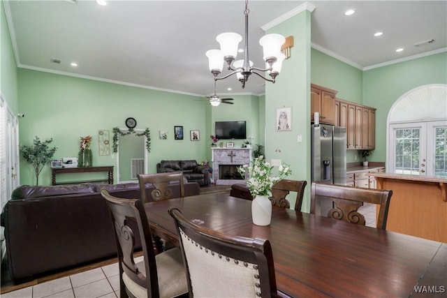 6650 Flatwoods Rd, Northport, AL 35473 - dining space featuring a fireplace, recessed lighting, a chandelier, ornamental molding, and light tile patterned floors