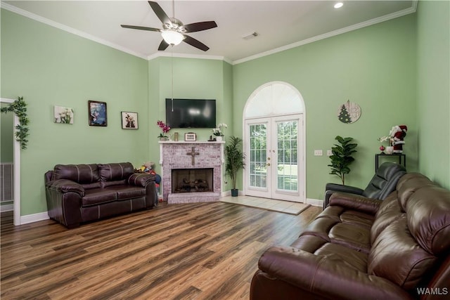 6650 Flatwoods Rd, Northport, AL 35473 - living area with a ceiling fan, wood finished floors, baseboards, ornamental molding, and a fireplace