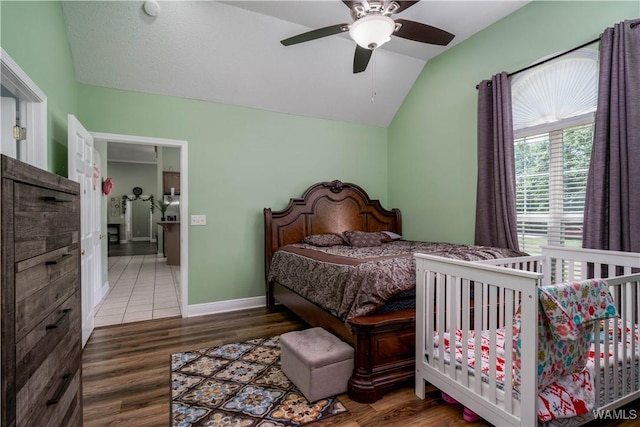 6650 Flatwoods Rd, Northport, AL 35473 - bedroom featuring vaulted ceiling, wood finished floors, ceiling fan, and baseboards