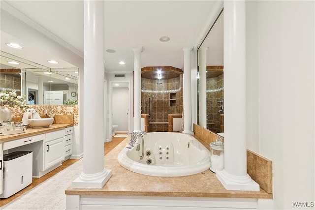 bathroom with vanity, independent shower and bath, and decorative columns