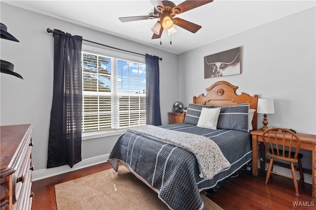 bedroom featuring ceiling fan and dark wood-type flooring