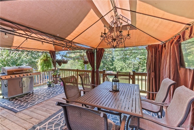 wooden terrace featuring a gazebo and area for grilling