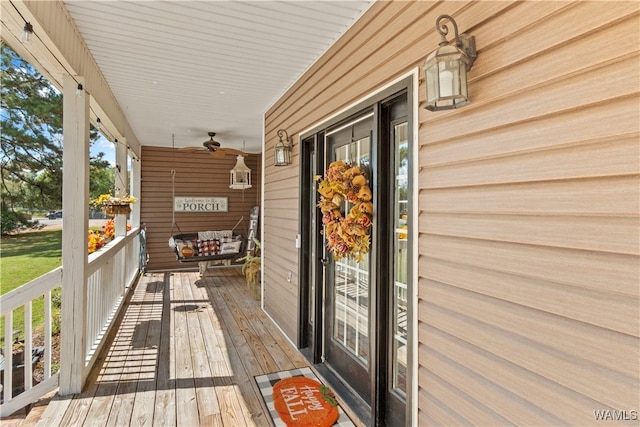 exterior space featuring ceiling fan and a porch