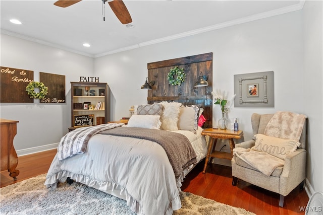 bedroom featuring ceiling fan, dark hardwood / wood-style floors, and ornamental molding