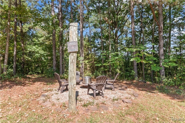 view of yard with an outdoor fire pit