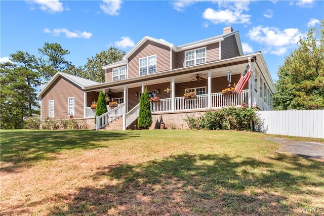 view of front facade featuring covered porch and a front yard