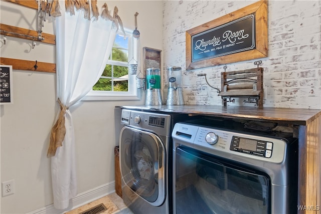 laundry area featuring washing machine and clothes dryer