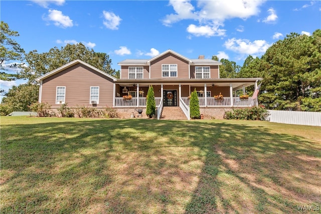 view of front of home featuring covered porch and a front yard