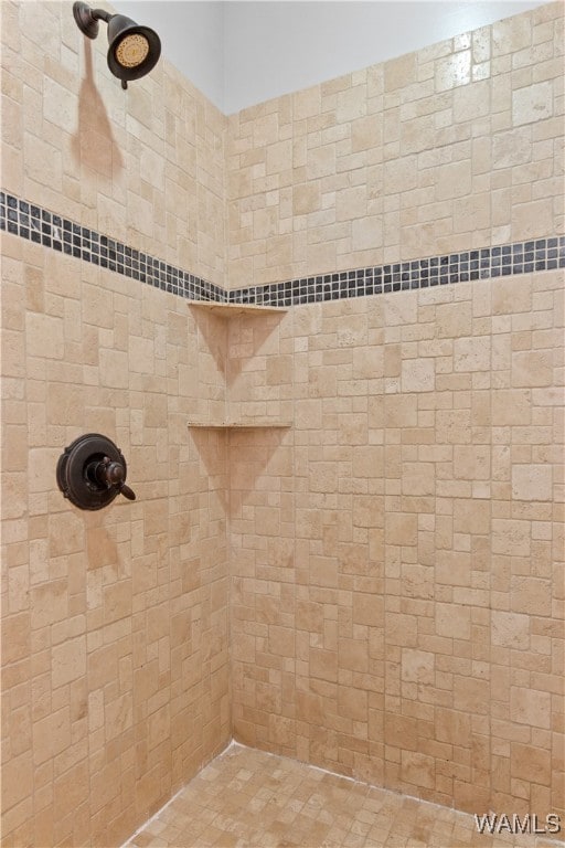 bathroom featuring tiled shower