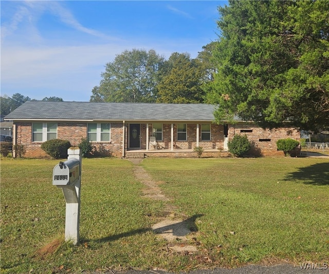 ranch-style house featuring a front yard