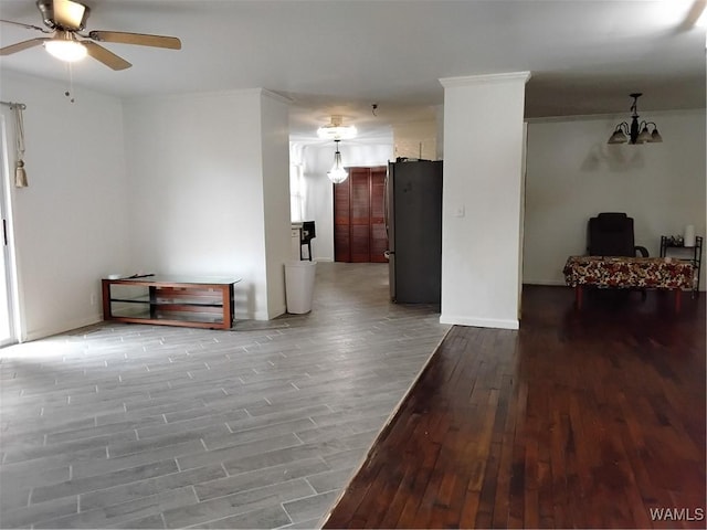 interior space with wood-type flooring and ceiling fan