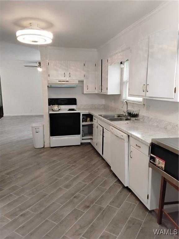 kitchen featuring range with electric cooktop, white cabinetry, dishwasher, sink, and crown molding