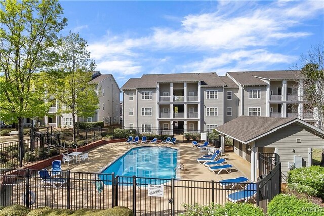 303 Helen Keller Blvd Unit B223, Tuscaloosa, AL 35404 - community pool featuring a patio and a residential view